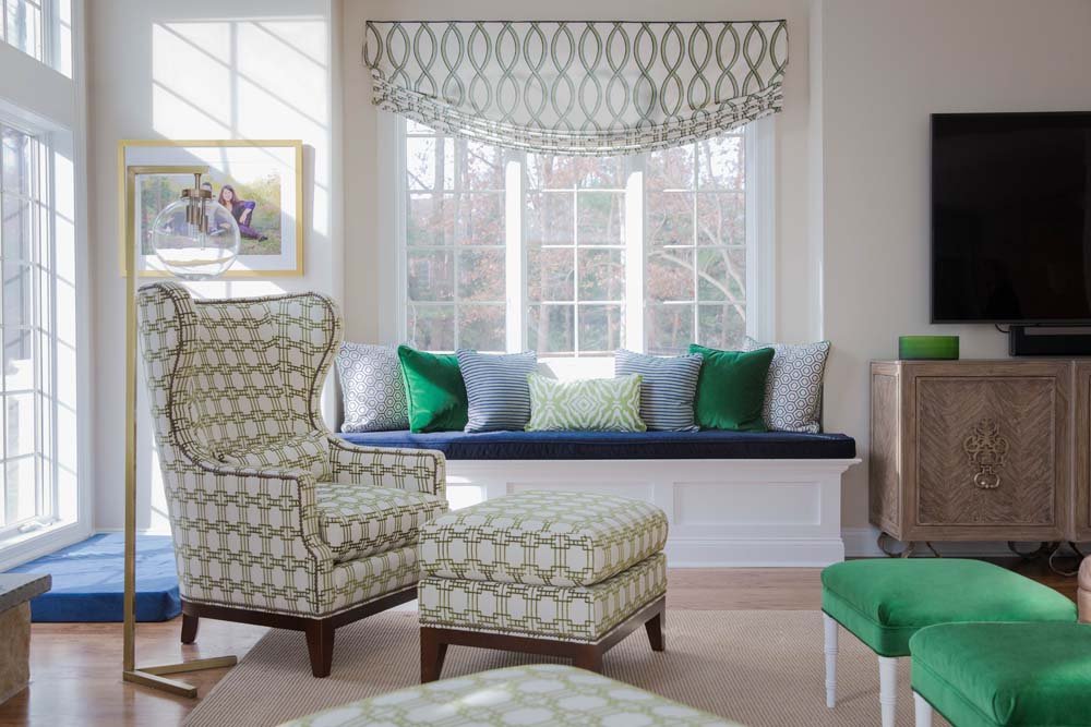 Room design by Sharon Goldberg Interior Design in Haddonfield, NJ beautiful interior designer room featuring window seat and vintage arm chair in Haddonfield, NJ