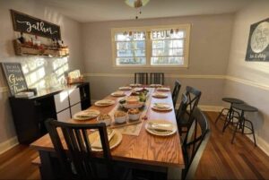 Festive dining room table set for Thanksgiving